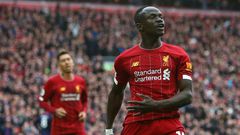 Liverpool's Senegalese striker Sadio Mane (R) has donated $50000 US dollars to the Coronavirus fight in gis country