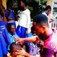 Dancing teacher Percy Sackey cuts his pupils hair