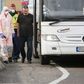 Hungarian police and medics control passengers on a bus at the border -- huge tailbacks have ensued since Budapest shut its borders Monday, albeit the rules seemed to be being applied arbitrarily in at least some cases