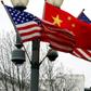 Chinese and US flags fly from a lampost near the White House in Washington. Beijing says a recent decision by the US to expelled two Chinese embassy officials was a 'mistake'