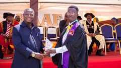 Alhassan Mohammed (R) receiving his certificate at the graduation ceremony