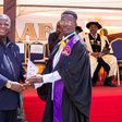 Alhassan Mohammed (R) receiving his certificate at the graduation ceremony