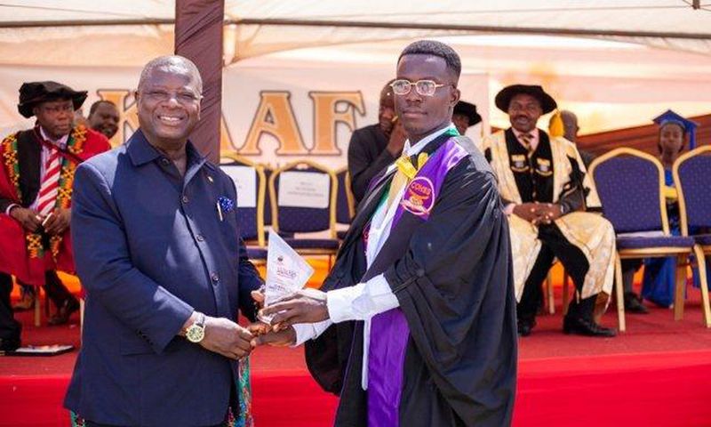Alhassan Mohammed (R) receiving his certificate at the graduation ceremony