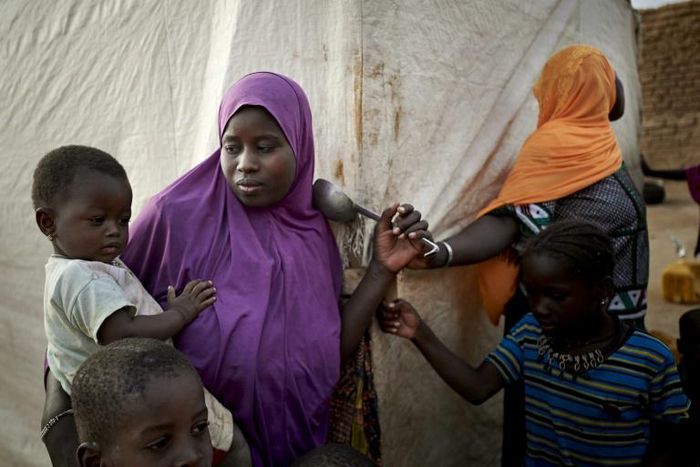 Displaced women are seen in a courtyard of Sevare where they found shelter after fleeing their village of Guerri in central Mali