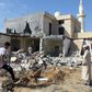 Libyans check the site of an air strike that killed three children in October, 2019 on the outskirts of the capital Tripoli as forces of eastern strongman Khalifa Haftar battled forces loyal to the UN-recognised Government of National Accord (GNA)