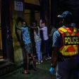 Police line up suspected lockdown violators in Johannesburg's Central Business District