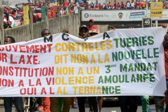 People take part in a January 2020 anti-government rally to protest against President Alpha Conde plans to stay in office for a third term, in Conakry