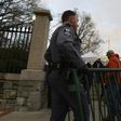Virginia State Capitol police officers move barriers near one of the entrances to the State Capitol building in Richmond, ahead of a pro-gun rights rally