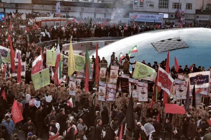 Clutching portraits of their hero, the crowd gathered on the outskirts of Tehran University where the supreme leader is to preside over prayers for  military commander Qasem Soleimani