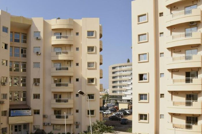 Housing boom: New apartment blocks are being built in Dakar, but spiralling rents make living there a distant dream for many