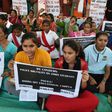 Students hold  placards during 'Nirbhaya Day' to mark the anniversary of the brutal rape case of a 23-year-old physiotherapy student on a bus in New Delhi in 2012