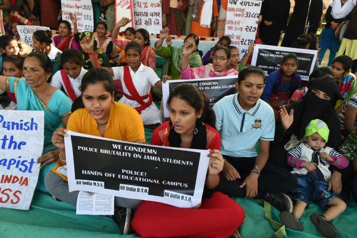 Students hold  placards during 'Nirbhaya Day' to mark the anniversary of the brutal rape case of a 23-year-old physiotherapy student on a bus in New Delhi in 2012