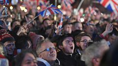 Men and women of all ages from around the country, many decked out in the red, white and blue colours of the Union Jack flag, hugged and kissed, while fireworks were set off into the night sky