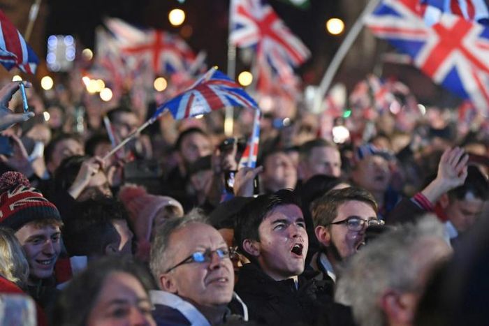 Men and women of all ages from around the country, many decked out in the red, white and blue colours of the Union Jack flag, hugged and kissed, while fireworks were set off into the night sky