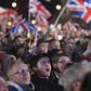 Men and women of all ages from around the country, many decked out in the red, white and blue colours of the Union Jack flag, hugged and kissed, while fireworks were set off into the night sky