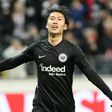 Frankfurt's Japanese midfielder Daichi Kamada celebrates scoring the 2-0 past Salzburg's Austrian goalkeeper Cican Stankovic during the Europa League last 32 first leg football match between Eintracht Frankfurt and Salzburg in Frankfurt am Main on Febr...