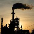 The sun sets behind smoke rising from the LyondellBasell-Houston Refining plant in Houston, Texas, as US crude futures fell below zero for the first time