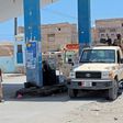 Yemeni pro-government fighters gather at a petrol station on April 10 in the coastal town of Shihr, in the southern Hadramawt province where the country's first case of coronavirus was reported