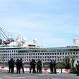 French police officers face demonstrators in Le Port on March 1, 2020, as people protest passengers from the Sun Princess cruise ship on the Indian Ocean island of La Reunion disembarking without having temperatures checked; The incident came hours aft...