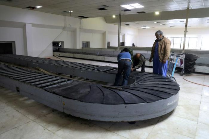 Workers at the Libyan capital's Mitiga airport
