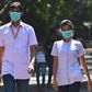 Medical staff wearing facemasks amid concerns of the spread of the coronavirus leave a hospital in Mumbai on March 12