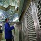 Iranian sanitary workers disinfect the Masumeh shrine in the Shiite holy city of Qom, where a prominent local member of parliament is among the latest people infected with the coronavirus