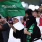 Vocal minority: Saudi supporters wave their national flag as their team defeat Qatar in the Gulf Cup semi-finals