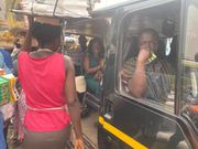 Comfort Doyoe Cudjoe Ghansah sits in trotro