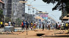 Protesters confront the Guinean army in the streets in Conakry on March 22, 2020, during a constitutional referendum in the country