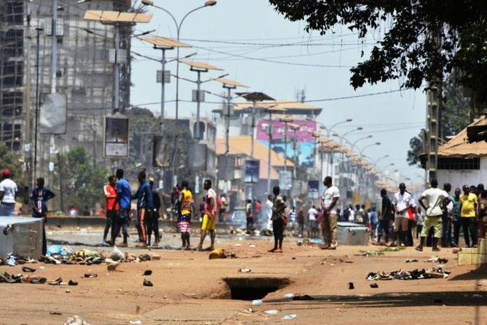 Protesters confront the Guinean army in the streets in Conakry on March 22, 2020, during a constitutional referendum in the country