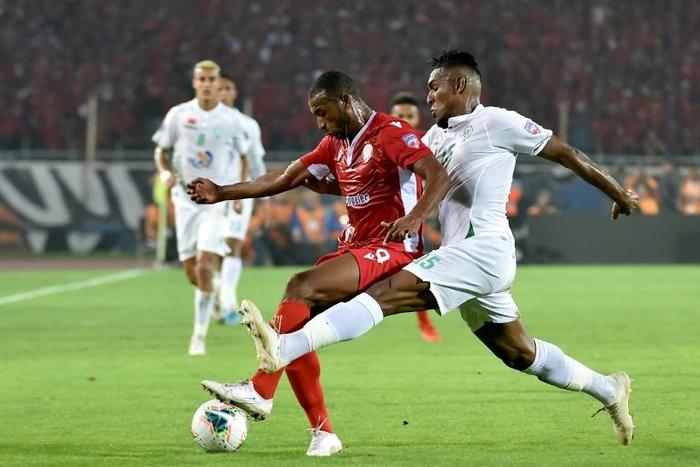 Ayoub el Kaabi (C) scored a hat-trick for Moroccan club Wydad Casablanca in a CAF Champions League victory over Petro Luanda of Angola
