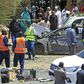 Sudanese rescue teams and security forces circle damaged vehicles at the site of a bomb attack targeting the convoy of Prime Minister Abdalla Hamdok, who survived the attack unharmed