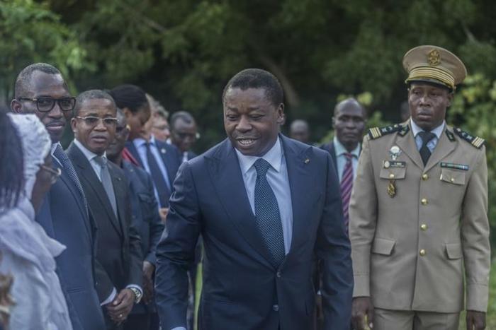 Togolese President Faure Gnassingbe (C) looks set to win another term this year