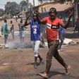 Protesters burn rubbish and block roads along the "axis of democracy" as demonstrations broke out in Conakry in February 2020 after Guinea's President Alpha Conde postponed a parliamentary election