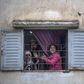 Moroccans confined at home thank the authorities from their windows as security forces and health workers instruct people to return to and remain at home as a measure against the COVID-19 coronavirus pandemic, in Rabat's district of Takadoum