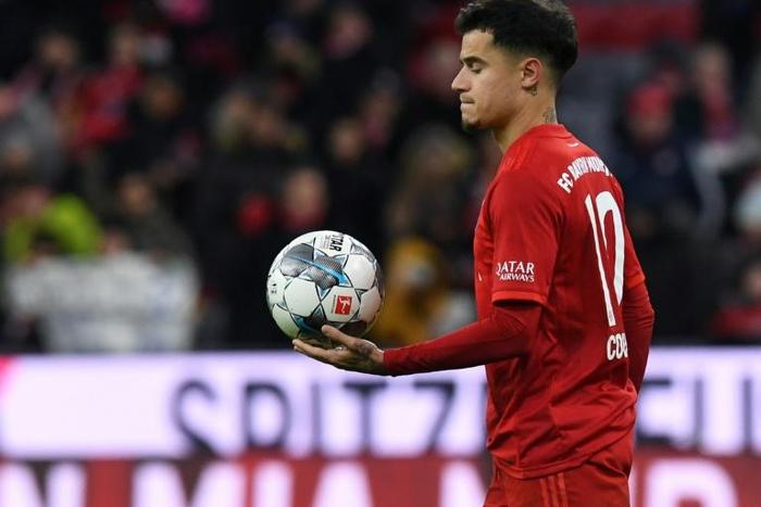 Philippe Coutinho walks off with the match ball after his hat-trick against Werder Bremen