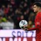 Philippe Coutinho walks off with the match ball after his hat-trick against Werder Bremen