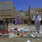 A Yemeni volunteer sprays disinfectant in a poor district of the capital Sanaa amid fears of a coronavirus outbreak