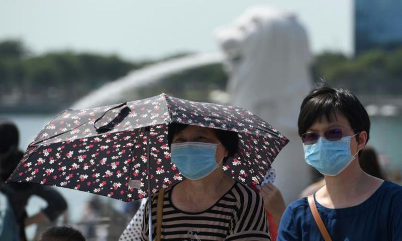 Singapore has clazmped down on visitors from China in a bid to stop the spread of the coronavirus, but will allow the countries airforce to take part in a popular air show