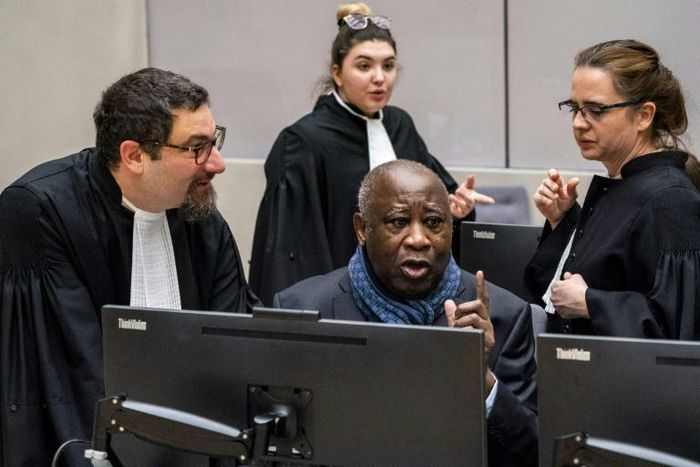 Former Ivory Coast President Laurent Gbagbo (C) has asked the ICC for unconditional release following his acquittal last year