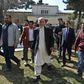 Afghan President Ashraf Ghani (C), walking with journalists after a press conference at the presidential palace, said he would not commit to a clause in the US-Taliban deal calling for a massive prisoner exchange