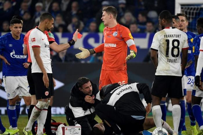Schalke goalkeeper Alexander Nuebel (C), who is currently serving a four-match ban, will leave the club at the end of the season