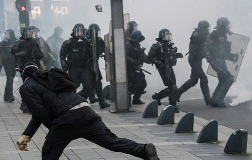 Riot police officers faced off against demonstrators during a "yellow vest" protest in Nantes, western France, on November 16
