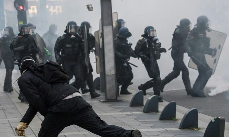 Riot police officers faced off against demonstrators during a "yellow vest" protest in Nantes, western France, on November 16