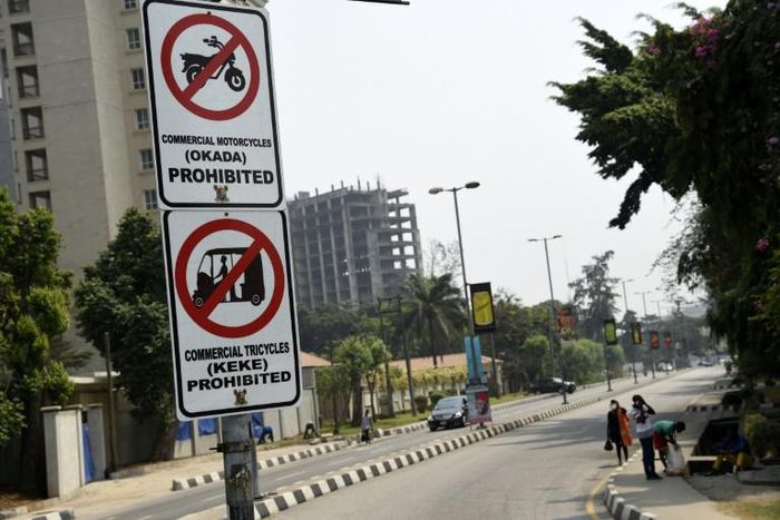 Signs displayed to reinforce a ban on motorbike taxis and motorised rickshaws, known locally as 'okadas' and 'kekes' which has sparked uproar in the Nigerian commercial capital Lagos
