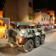Military vehicles patrol the streets in the Moroccan city of Marrakesh to help enforce the government's order for people to stay at home amid the coronavirus COVID-19 pandemic