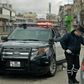 A policeman speaks to a driver at a checkpoint in the Jordanian capital Amman during a nationwide curfew imposed to control the spread of the novel coronavirus