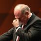 Outgoing Bayern Munich president Uli Hoeness fights back tears as he speaks at the club's annual general meeting on Friday