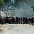Angry protesters barricade the main route to Zimbabwe's capital Harare from Epworth township in January 2019 demonstrations against a hike in fuel prices