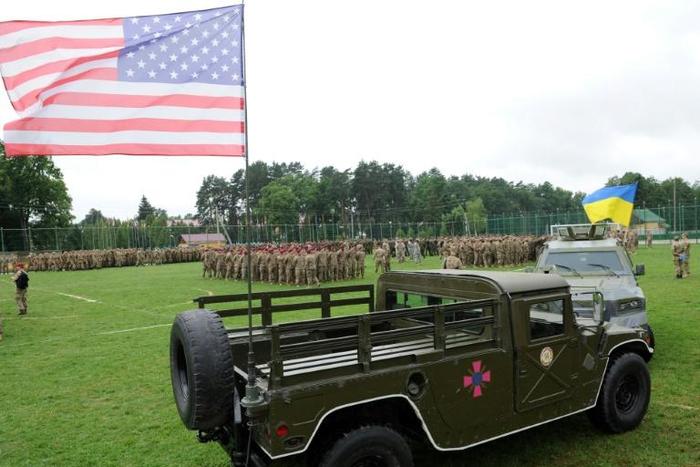 Ukrainian and US flags are flown at the opening of drills in western Ukraine's Lviv district in July 2015